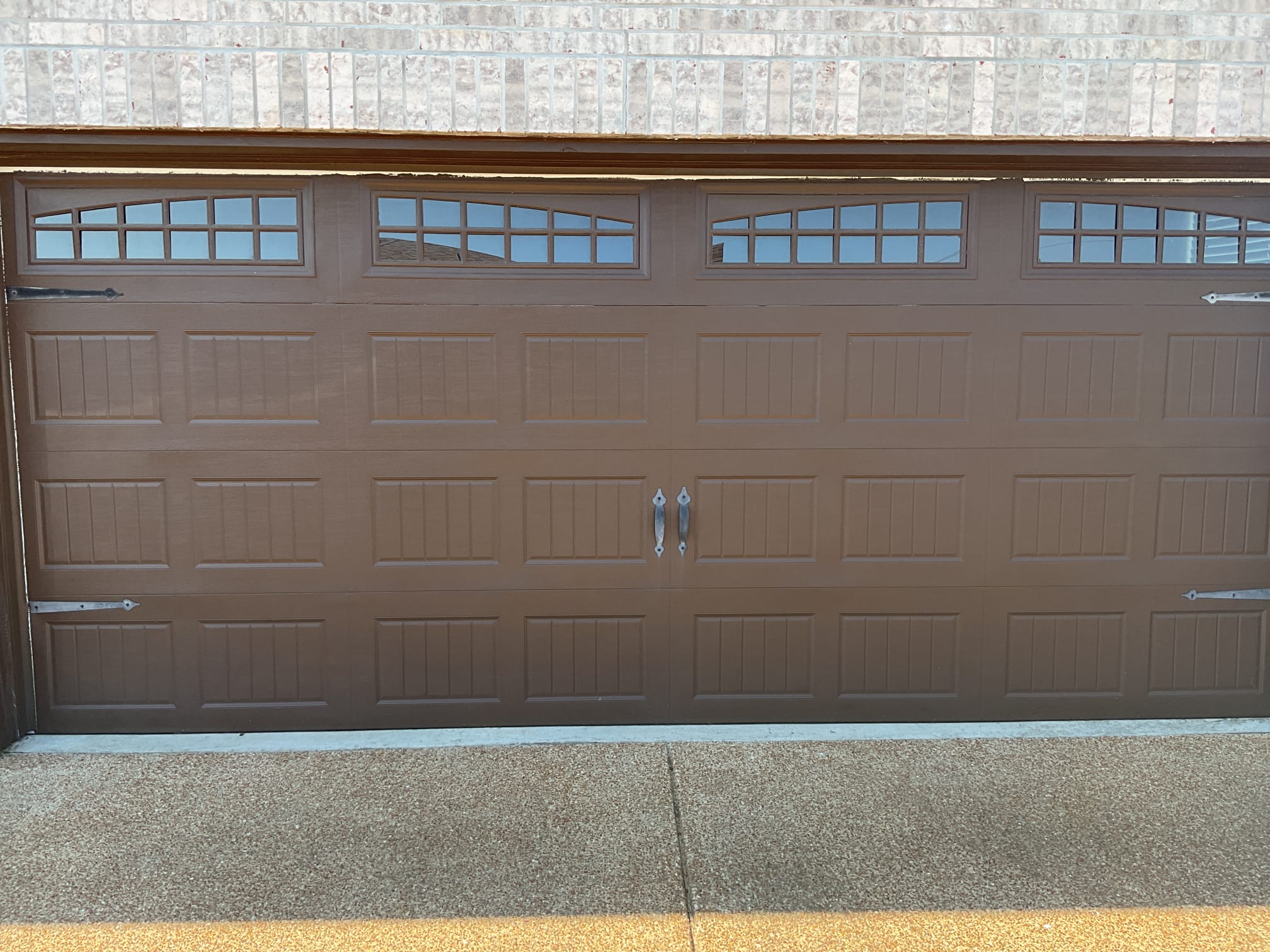 Finished brown windowed carriage garage door